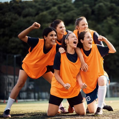 a group of athletes cheering together